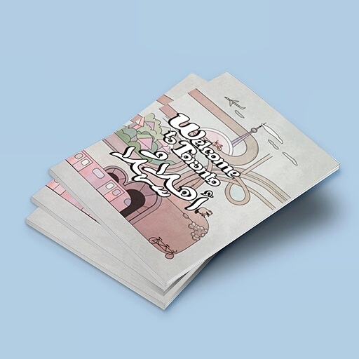 Stack of printed colouring books with a hand-lettered Welcome to Toronto cover
